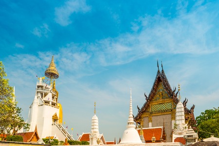 Beautifully decorated stupas at Wat Intharawihan temple, Bangkok, Thailand. Traditional religious architecture, one of the main attractions on Bangkok.の写真素材