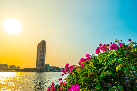 Cityscape of Bangkok viewed across Chopraya river at sunset, Thailandの写真素材