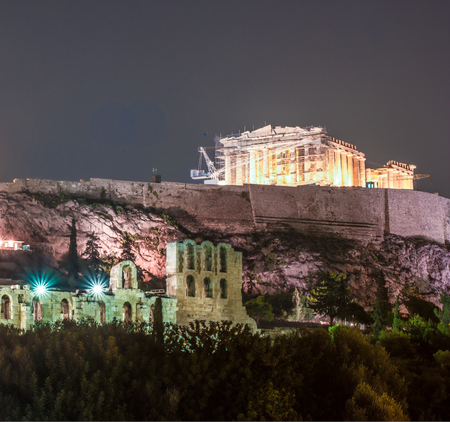 Parthenon and Herodium construction in Acropolis Hill in Athens, Greece shot in blue hourの写真素材