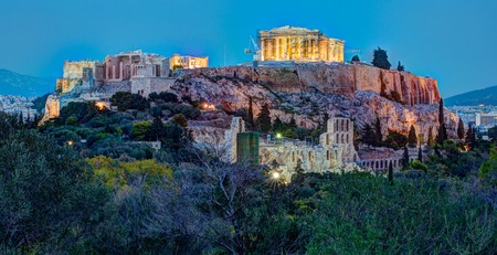 Parthenon and Herodium construction in Acropolis Hill in Athens, Greece shot in blue hourの写真素材