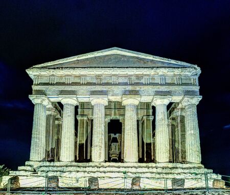Antique greek temple of Concordia in the Valley of Temples, Agrigento, Sicily, Italy, at nightの写真素材