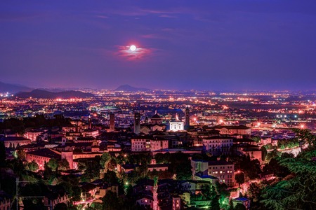 View at Old Town Citta Alta of Bergamo from San Vigilio Hill. Bergamo, Italy. Night view.の写真素材