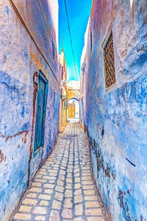 Traditional old painted door in a historical district or medina, Tunisia.の写真素材