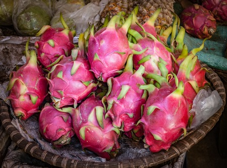 Dragonfruits at a street market basket in Vietnamの写真素材