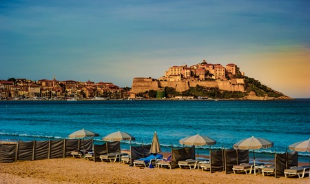 View of citadel with houses in Calvi bay, Corsica island, France.の写真素材