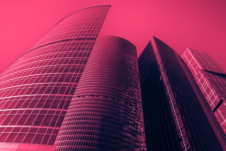 modern office buildings. Vintage looking image with washed out colors and red color castの写真素材