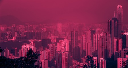 Hong Kong Skyline View From Victoria Peak. Vintage looking image with washed out colors and red color castの写真素材