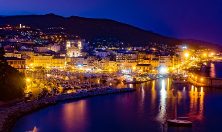 Bastia old city center at night, lighthouse and harbour. Bastia is second biggest town on Corsica, France, Europe.の写真素材