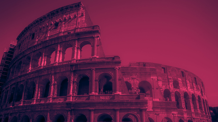 Colosseum (Coliseum) in Rome, Italy. Vintage looking image with washed out colors and red color castの写真素材