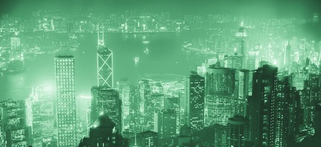 Famous view of Hong Kong - Hong Kong skyscrapers skyline cityscape view from Victoria Peak illuminated in the evening blue hour. Hong Kong, Chinaの写真素材