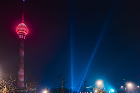 The Central Radio and Television Tower at night with colorful illumination, Beijing, China.