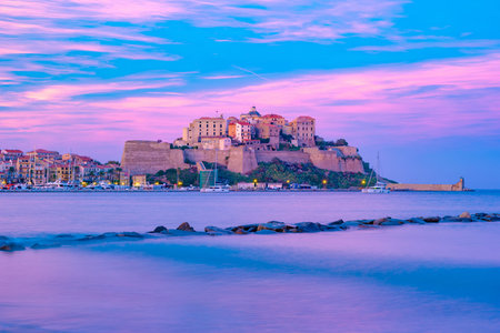 View of colorful houses in Calvi port. This town has luxurious marina and is very popular tourist...