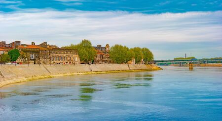 The river Rhone at Arles overlooking the old town. Buches du Rhone, Provence, France.の写真素材