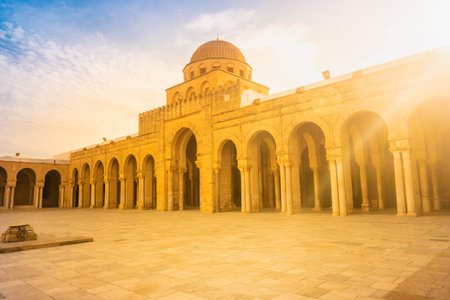 Ancient Great Mosque in Kairouan in Sahara Desert, Tunisia, Africa. An important destination in...