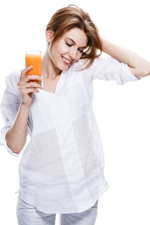 european woman with glass of orange juice - isolated on white backgroundの写真素材