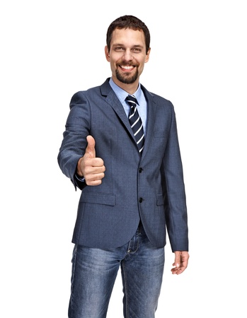 Handsome business man giving you thumbs up cheeringの写真素材