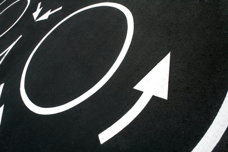 Circular motion road markings - photography of road markings and traffic symbol on surface roadの写真素材