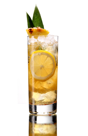 Lemonade with pineapple - studio photography of beverages isolated on white background with reflectionの写真素材