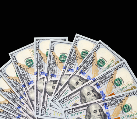 Group dollars in form of fan - studio photography of American national currency of hundred dollar isolated on black backgroundの写真素材