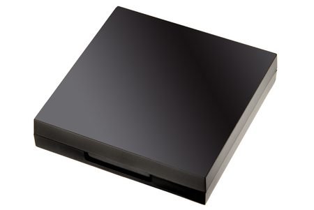 Black powder-case, powder box - studio photography of closed make-up powder box on white backgroundの写真素材