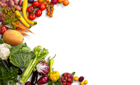 Healthy food background - studio photo of different fruits and vegetables on white backdrop