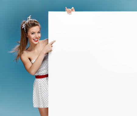 photo set of young American pin-up model on blue background with space for textの写真素材