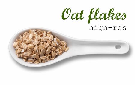 Rolled oats flakes in white porcelain spoon / high resolution product photography of seed in white porcelain spoon over white background with place for your textの写真素材