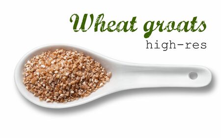 Wheat groats in white porcelain spoon / high resolution product photography of seed in white porcelain spoon over white background with place for your textの写真素材