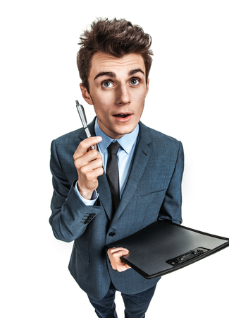 Young man having a good idea  photos of young businessman wearing  a suit and tie over white backgroundの写真素材