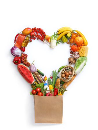 Heart symbol, studio photography of heart made from different fruits and vegetables - on white background. Healthy food background, top view. High resolution product,の写真素材