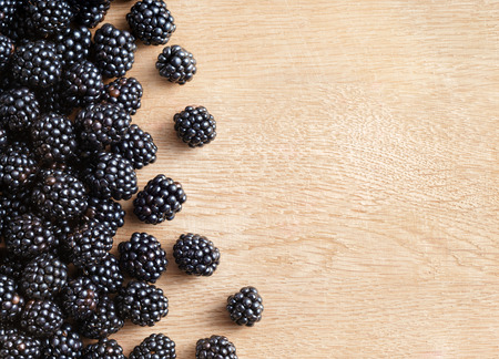 Blackberries on wooden background. Close up, top view, high resolution product. Harvest Conceptの写真素材