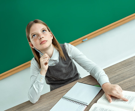 Pretty apprentice having some great idea. Photo of teen school girl, creative concept with Back to school themeの写真素材