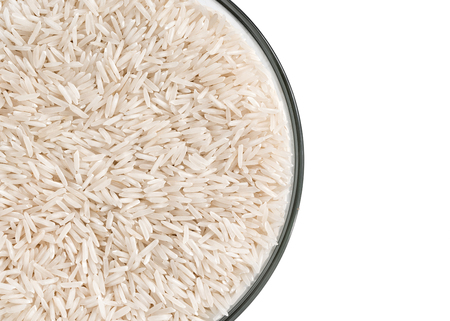 Glass bowl with white rice on white background. Close up, top view, high resolution product.の写真素材