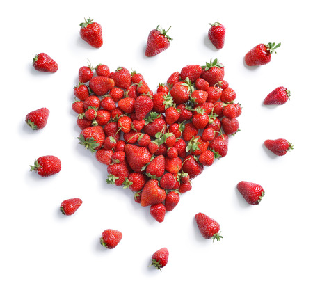 Heart symbol from strawberry isolated on white background. Fruits diet concept. Top view, High resolution product.の写真素材