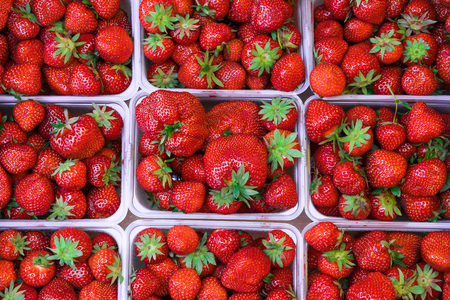 Fresh strawberry in baskets on the market. High resolution product.の写真素材