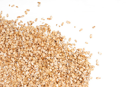 Oat flakes scattered on white background. Copy space, high resolution productの写真素材