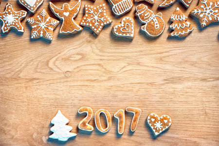 Merry Christmas! Homemade cookies on wooden background. Copy space for your text. Christmas baking...