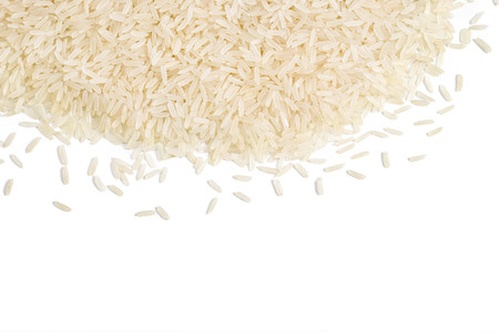 Parboiled rice scattered on white background. Copy space for your text. Top view, high resolution product. Healthy food conceptの写真素材