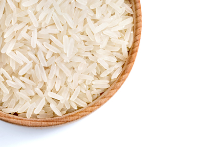 Healthy food. Close up of wooden bowl with parboiled rice on white background. Top view, high resolution product.の写真素材