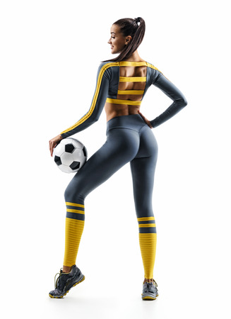 Sexual soccer player girl standing in silhouette isolated on white background. Rear view. Sport and healthy lifestyleの写真素材