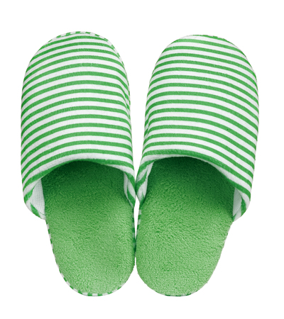 Green striped slippers isolated on white background. Close up, high resolutionの写真素材