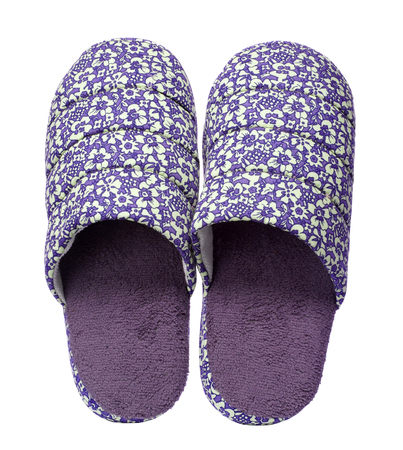 Violet slippers with flower print isolated on white background. Close up, high resolutionの写真素材