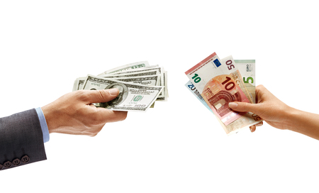 Man's hand holding dollars moneyand woman's hand holding euro money isolated on white background. Close up. Currency exchange. High resolution productの写真素材
