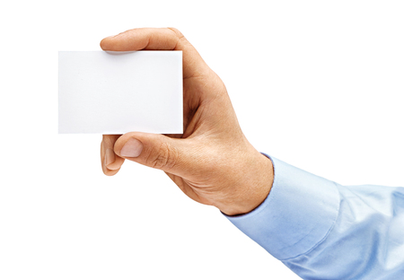 Man's hand in shirt holding empty business card isolated on white background. Close up. High resolution productの写真素材
