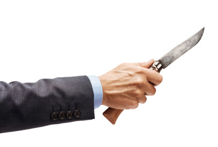 Man's hand in suit holding a knife isolated on white background. Close up. High resolution product