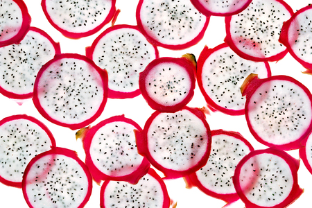 Slices of dragon fruit on white background. Close up. Top view. High resolution productの写真素材