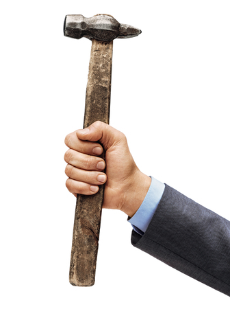 Man's hand in a suit holds a hammer isolated on white background. Close up. High resolution productの写真素材