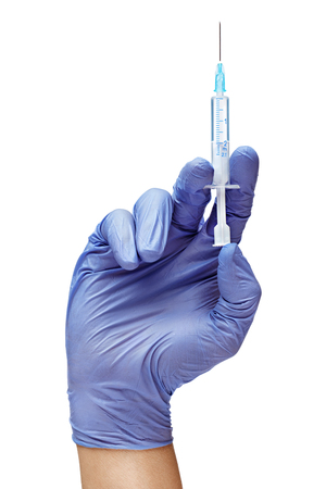 Man's hand in medical glove with syringe isolated on white background. Medical concept. Close up. High resolution productの写真素材