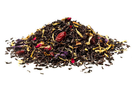Heap of Black tea with rose, cherry and pieces of cinnamon on white background. close up. high resolution.の写真素材