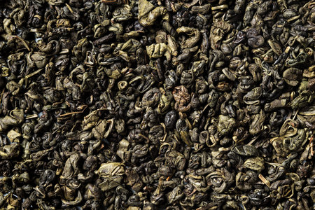 Ganpauder, green tea rolled into small round pellet on white background. top view. close up. high resolutionの写真素材